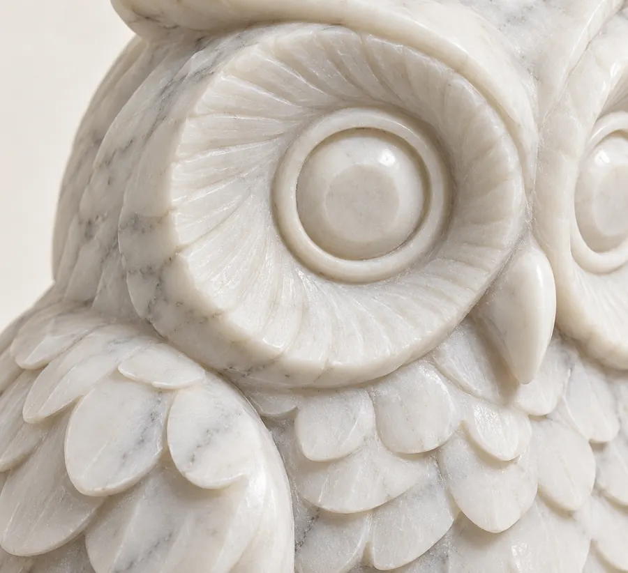 Owl Marble Shelf Figurine — close view of the carved round eye and feather layers